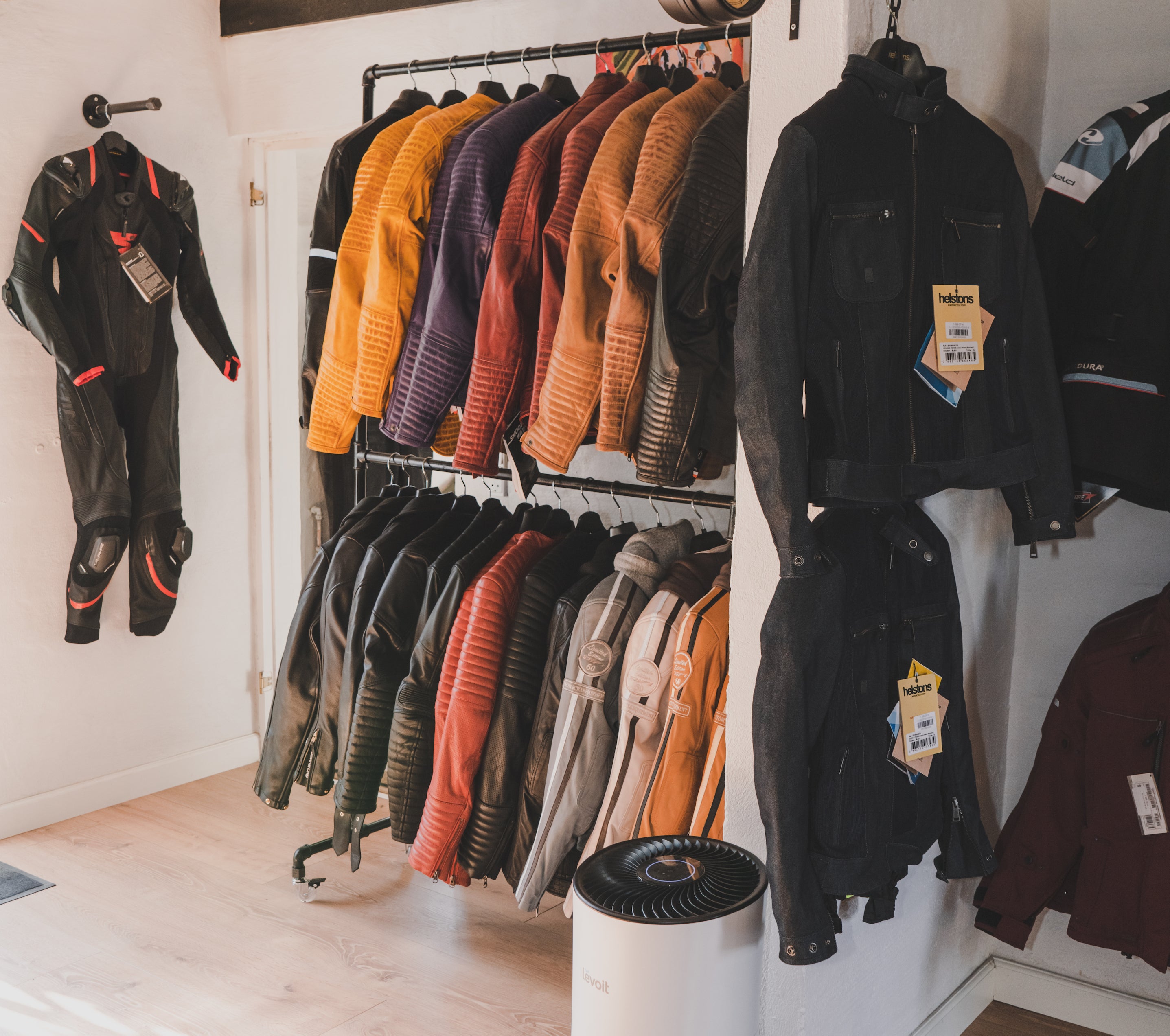 Motorcycle clothes for women hanging in the Moto Lounge shop