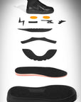 Black sneaker disassembled into its components on a gray background