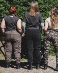 three women of difference sizes demonstrating the motorcycle cargo pants in different colous