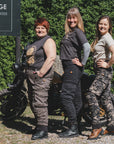 three women of difference sizes demonstrating the motorcycle cargo pants in different colous