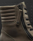 a close up of insides of brown leather women's motorcycle boots with shoe lens