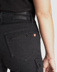 a close up of a back pocket of a woman wearing black cargo motorcycle pants