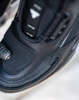 A close up of motorcycle boot changing gears