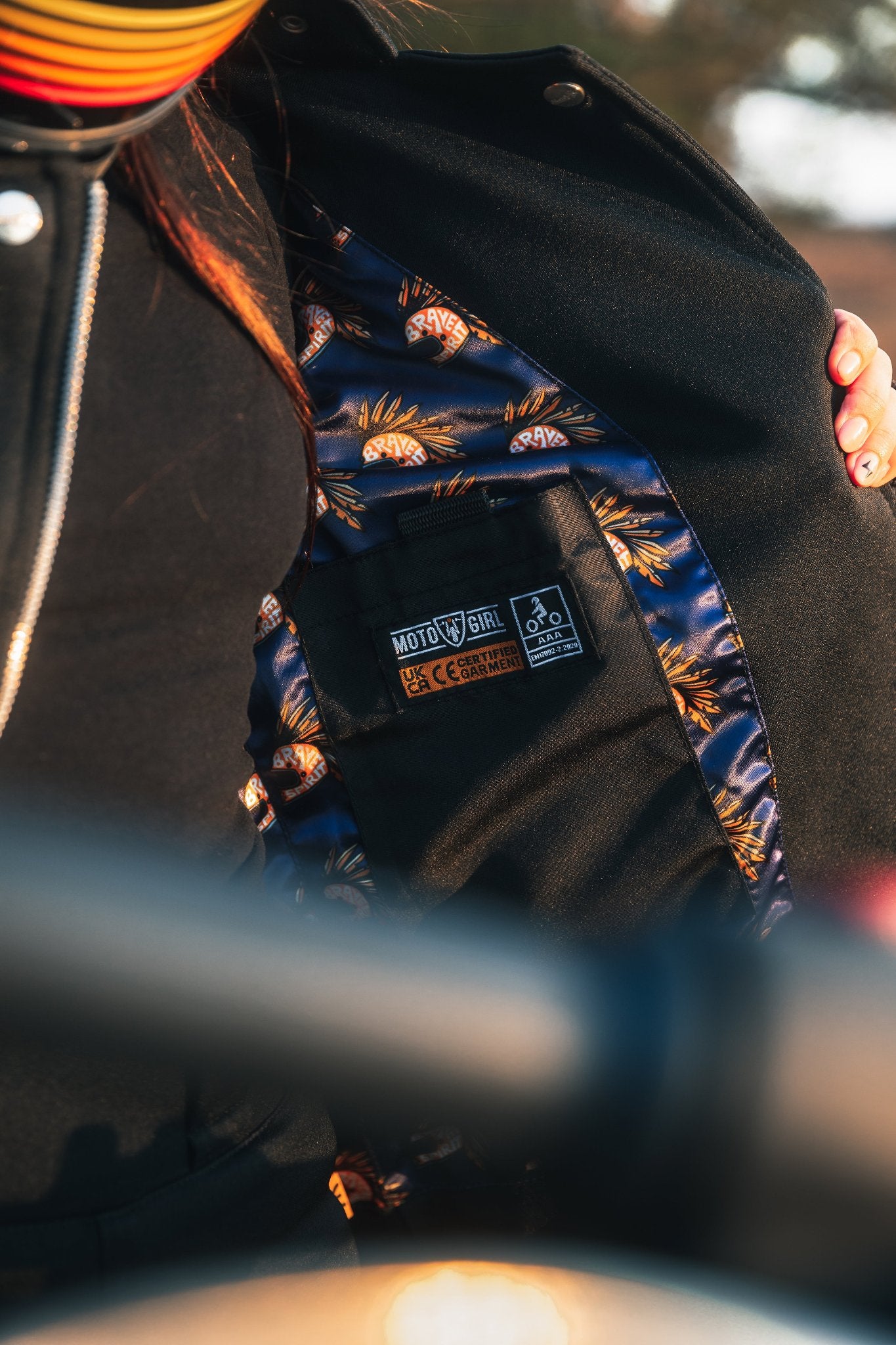inner pocket with AAA rating on a Black retro style woman's motorcycle jacket with silver zip details