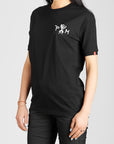 A woman  wearing black Pando Moto women's motorcycle t-shirt with Pando Moto logo