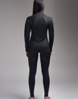 A woman posing from her back wearing protective motorcycle underwear