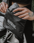 Women's hands taking out a jacket from the bag with Moto Girl logo