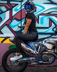 A woman wearing black and pink sewed women's motorcycle leggings from exagon66