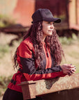 a  woman with the cap wearing red and black women's motorcycle summer jacket from Moto Girl