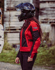 Two women with helmets on  wearing red and white women's motorcycle summer jackets from Moto Girl