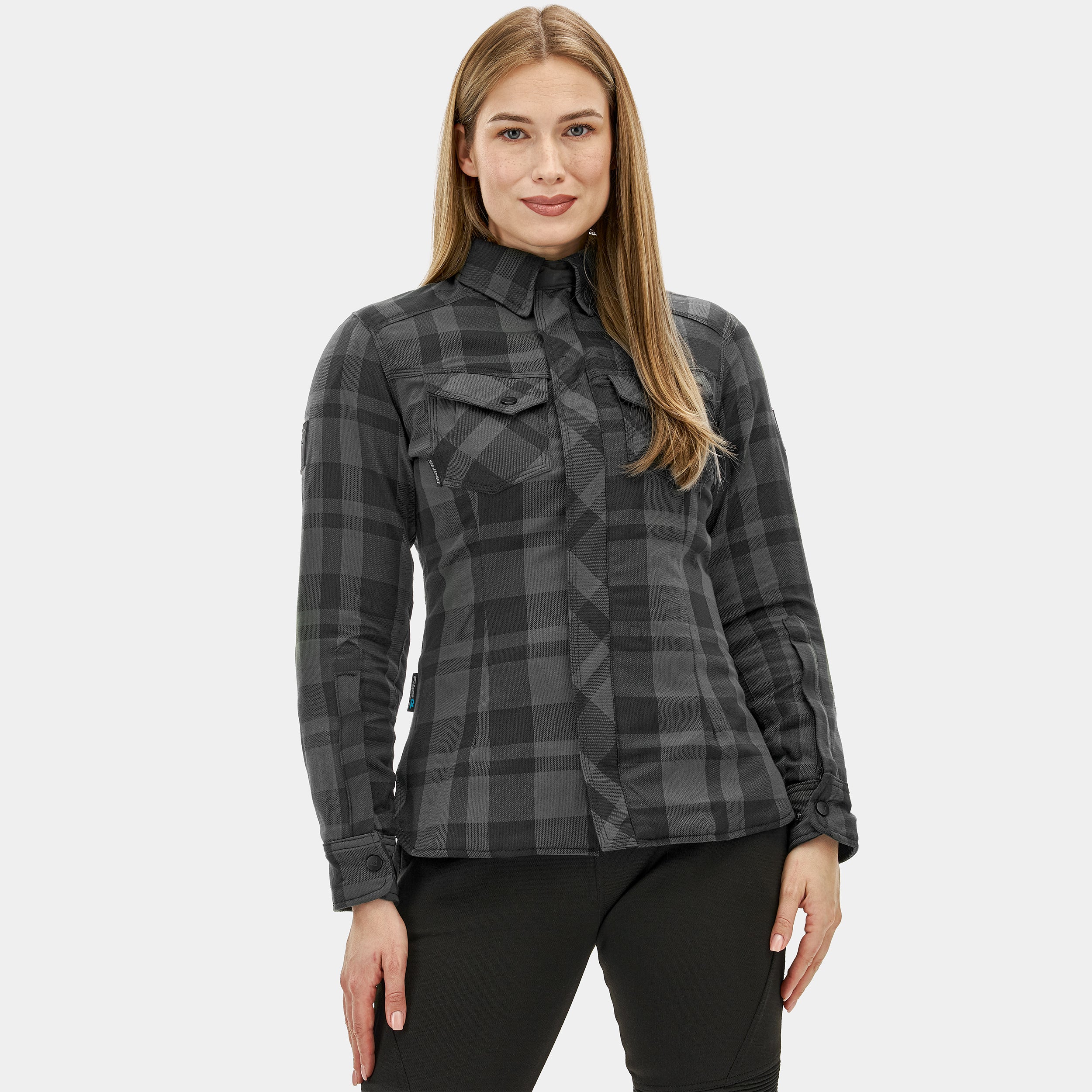 Woman wearing a gray plaid shirt on a white background