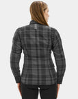 Woman wearing a gray plaid shirt on a white background