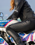 Woman sitting on motorcycle wearing Black Fiona Motorcycle Trousers from Moto Girl