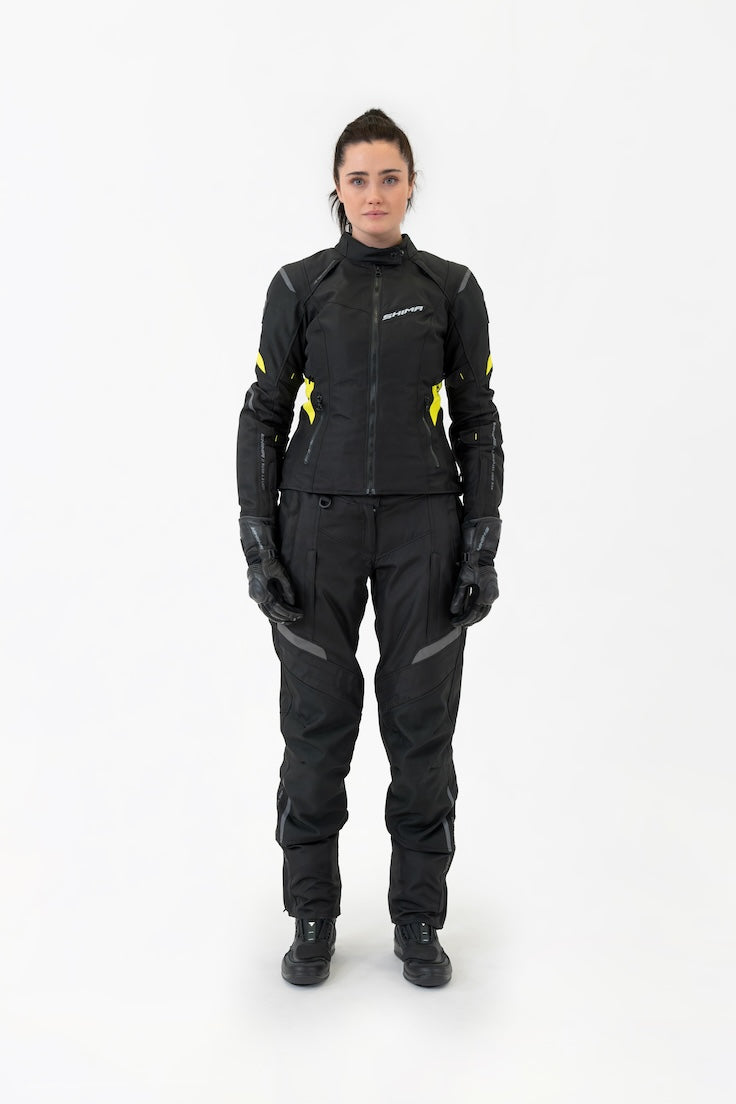 A woman standing still wearing motorcycle textile set from Shima