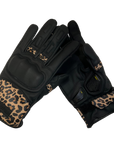 Black women's motorcycle gloves with colourful leopard skin details and  with paw print details on the index and middle fingers.