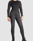 a woman wearing black jeans and black motorcycle body suit from Pando Moto 