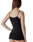 The back of a dark-haired woman wearing a black-colored sleeveless tank top with lace V-neckline from Tramonte.