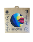 A square kraft paper packaging sleeve for a Moto Girl product, featuring a colorful circular cutout showing a close-up of lips with blue, yellow, and red tones. The sleeve includes black printed icons and text highlighting features like 100% UV protection, quick dry, and breathable.