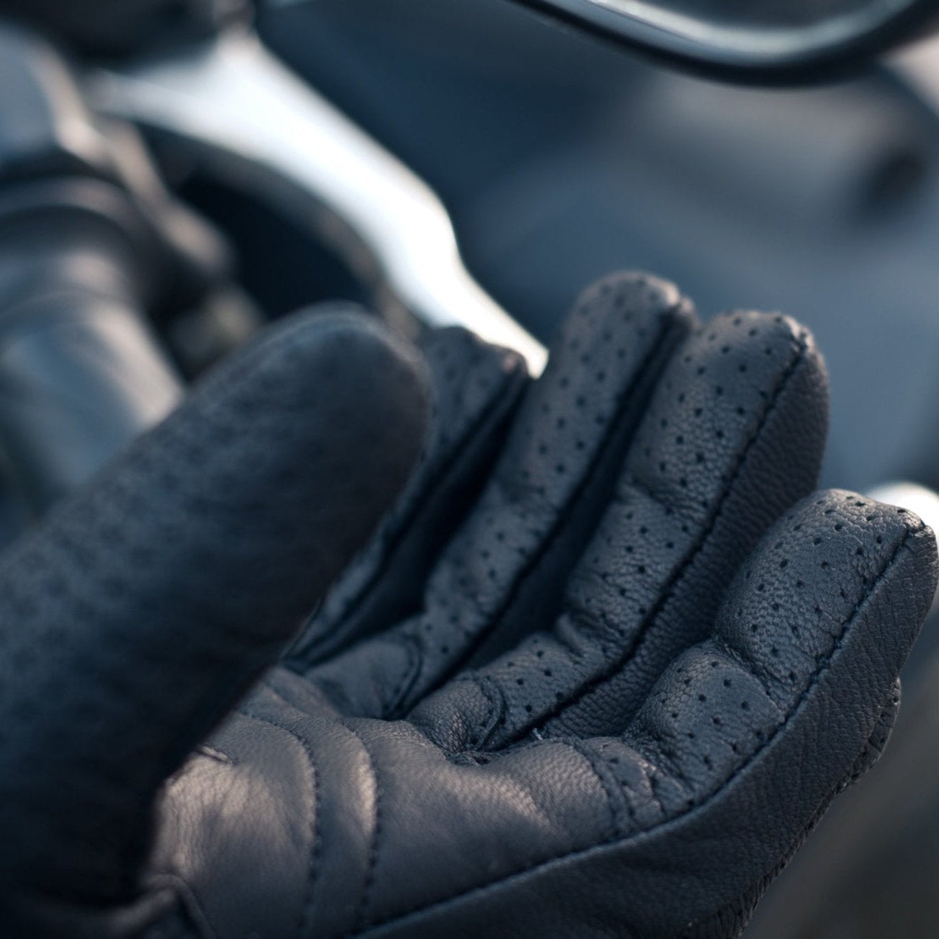 Fingers close up of black leather female motorcycle glove from Shima