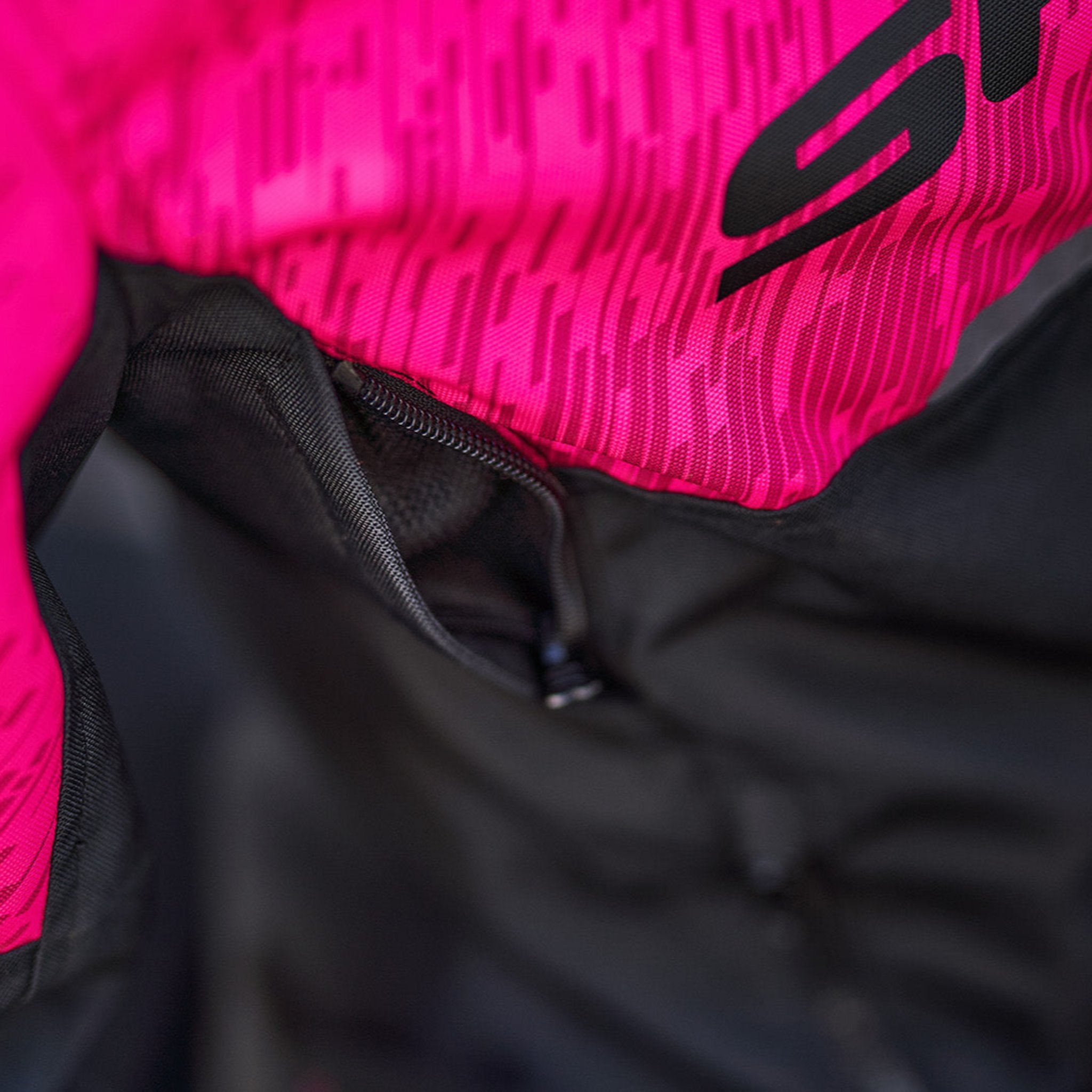 A close up of the ventilation panel on a pink DRIFT  motorcycle jacket from Shima