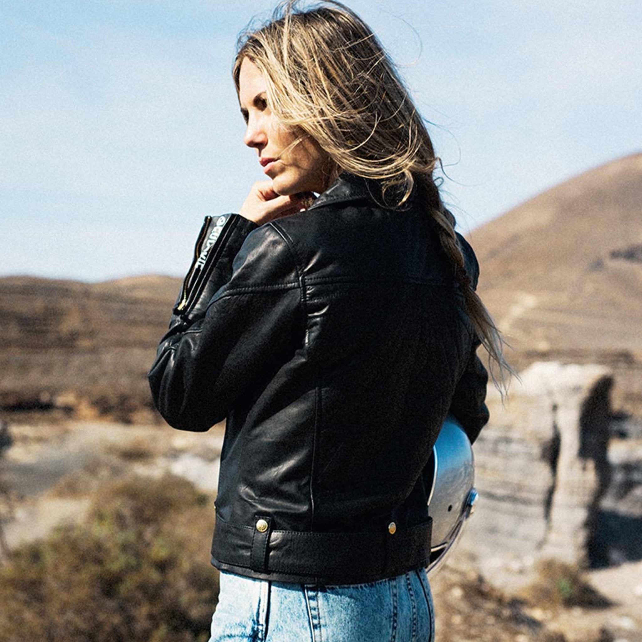 A woman wearing Classic retro black women&#39;s motorcycle jacket from Eudoxie