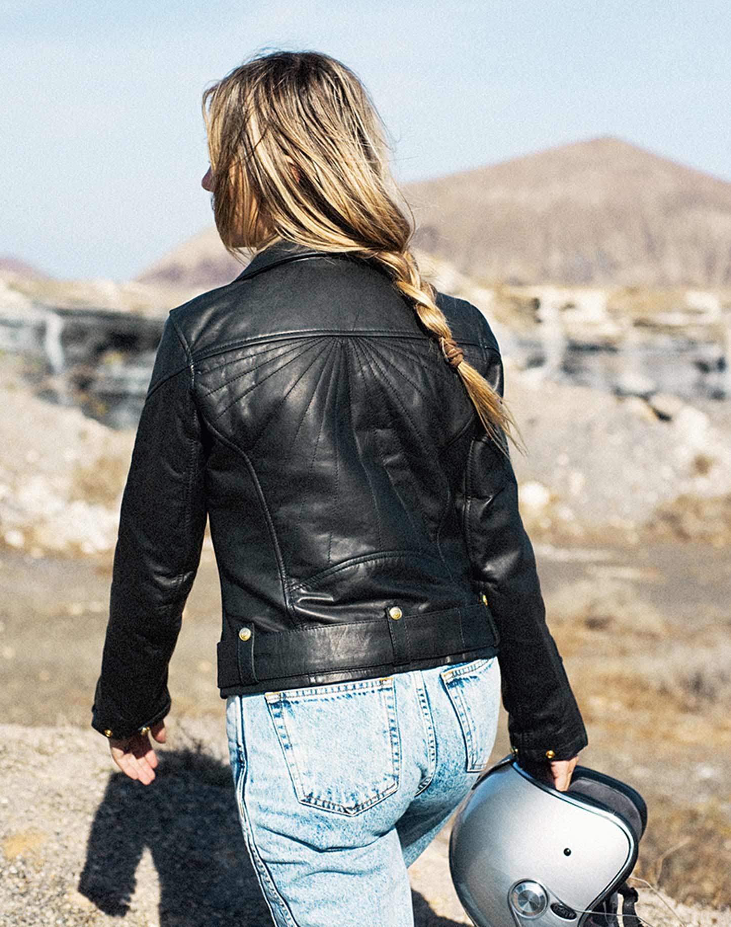 A women from the back wearing Classic retro black women&#39;s motorcycle jacket from Eudoxie