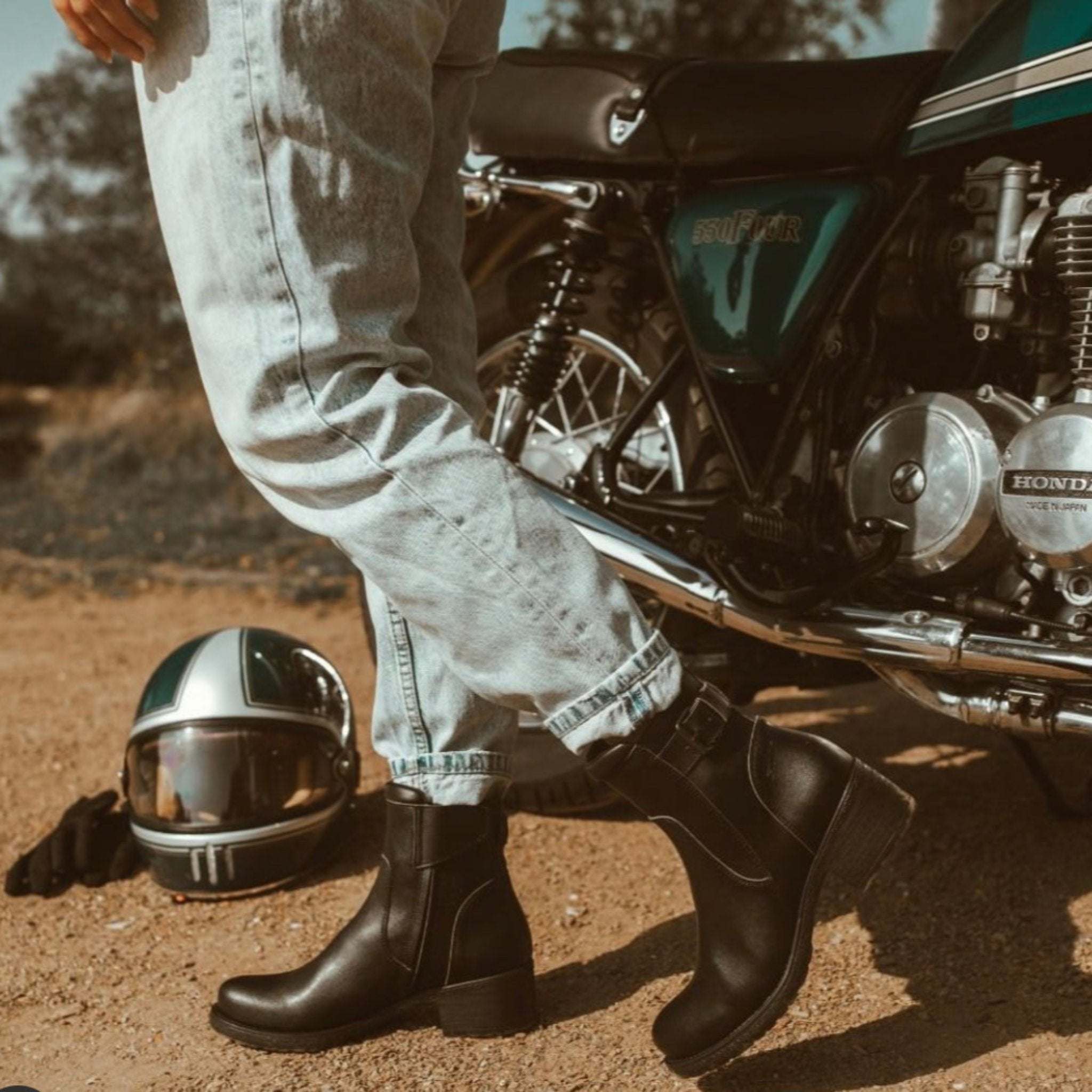 Woman wearing women&#39;s black leather motorcycle shoes 