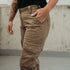 Woman's leg wearing beige motorcycle cargo pants from Moto Girl 