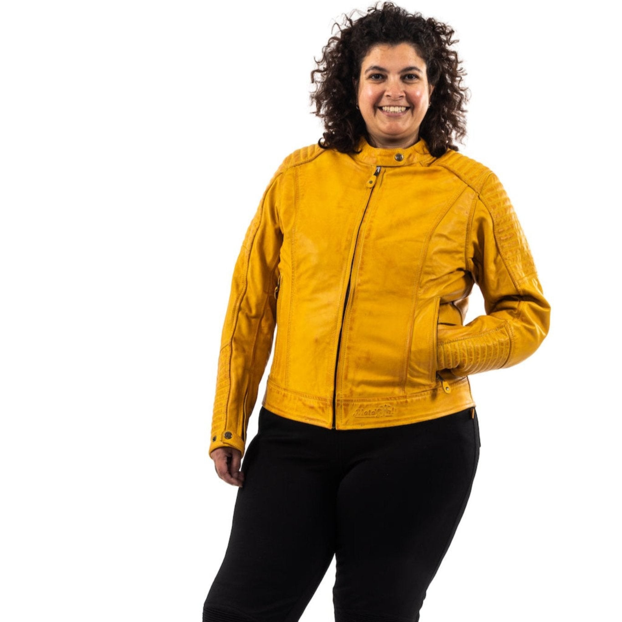 smiling woman wearing yellow motorcycle jacket  Valerie from moto girl 