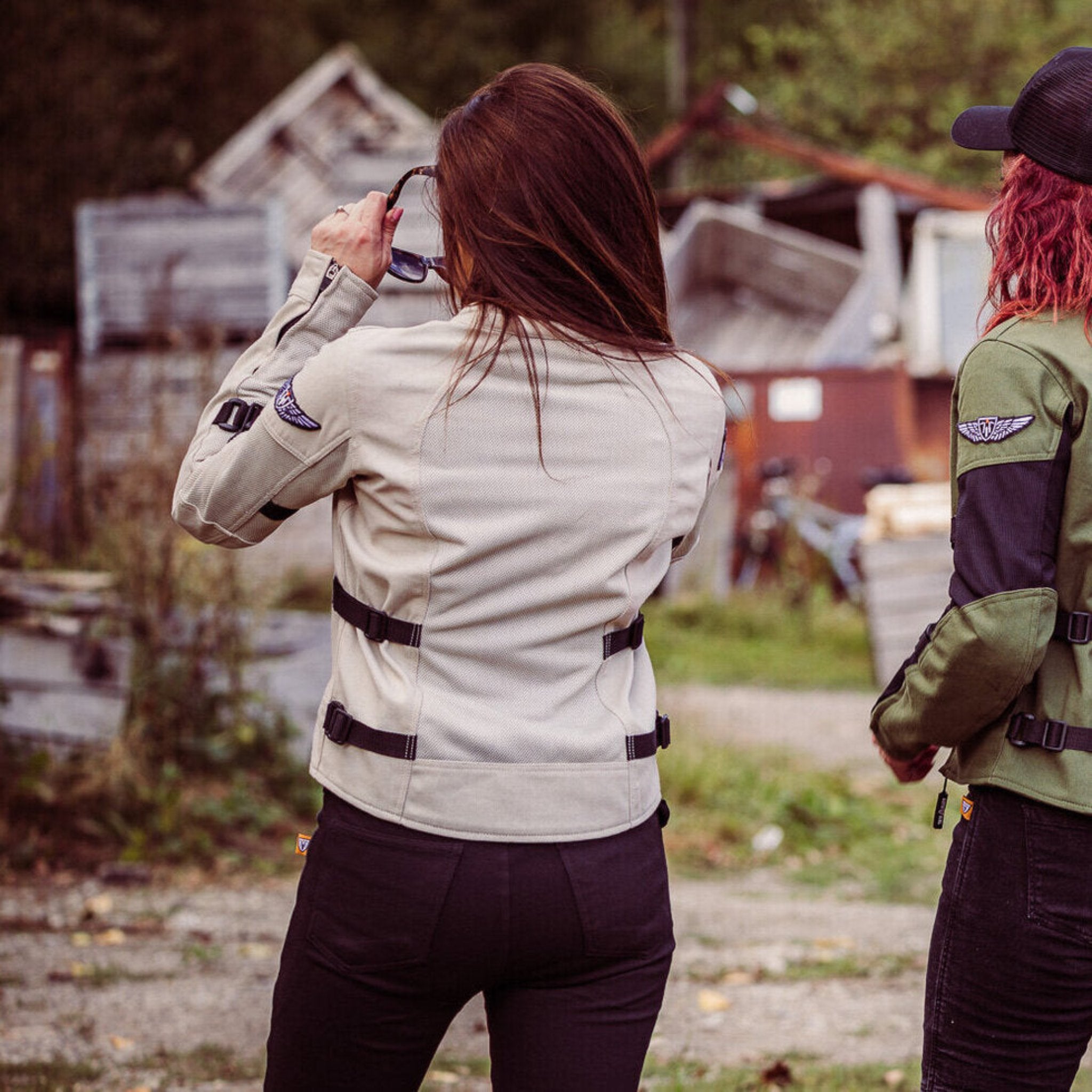 a back of a woman putting sunglasses on and wearing light color women&#39;s summer mesh motorcycle jacket from Moto Girl 