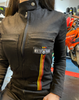 A close up of a woman's chest wearing black women's garage jumsuit with MotoGirl logo