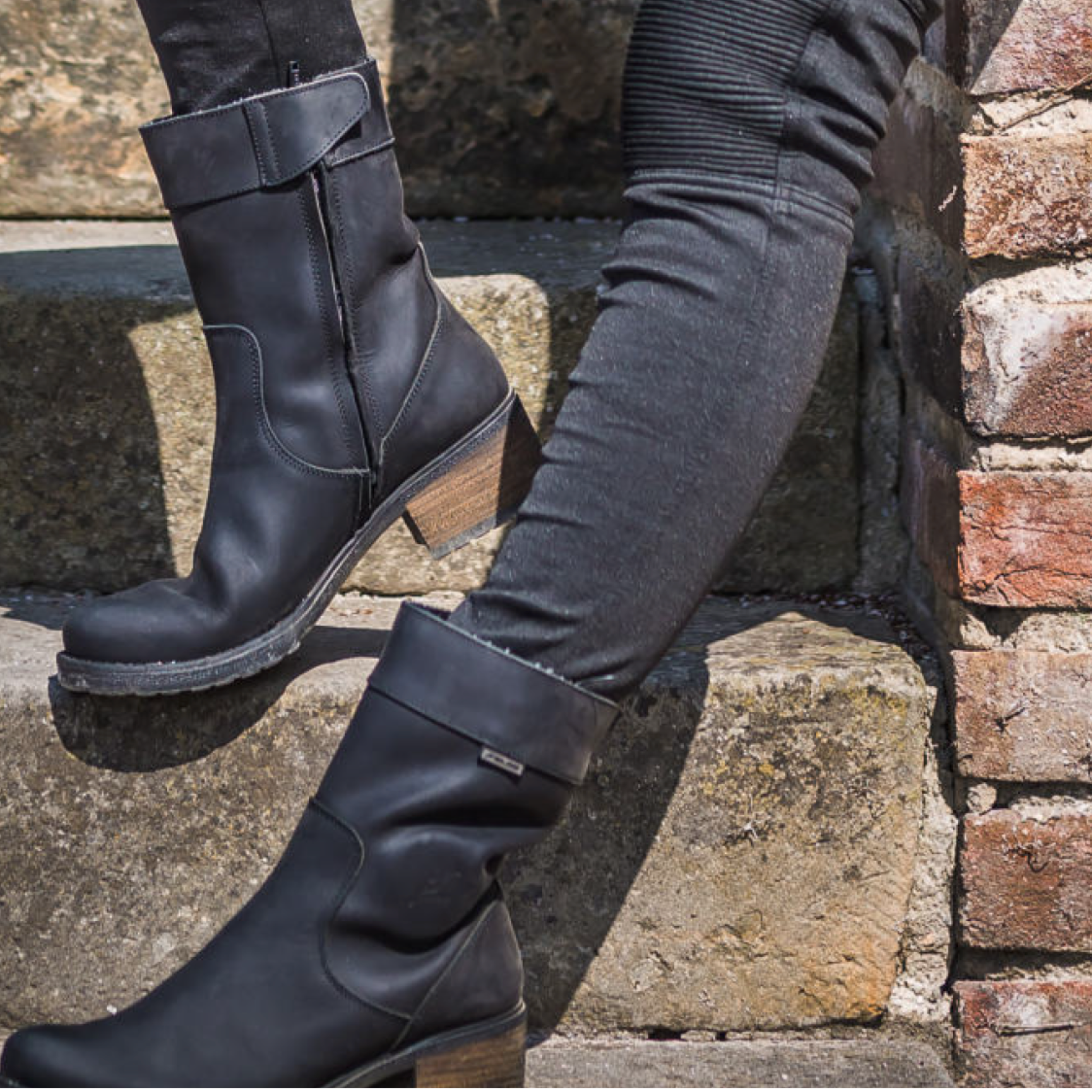 Woman's legs wearing black women's motorcycle boots from Falco 