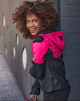 A young afroamerican woman wearing pink motorcycle jacket with the hood 