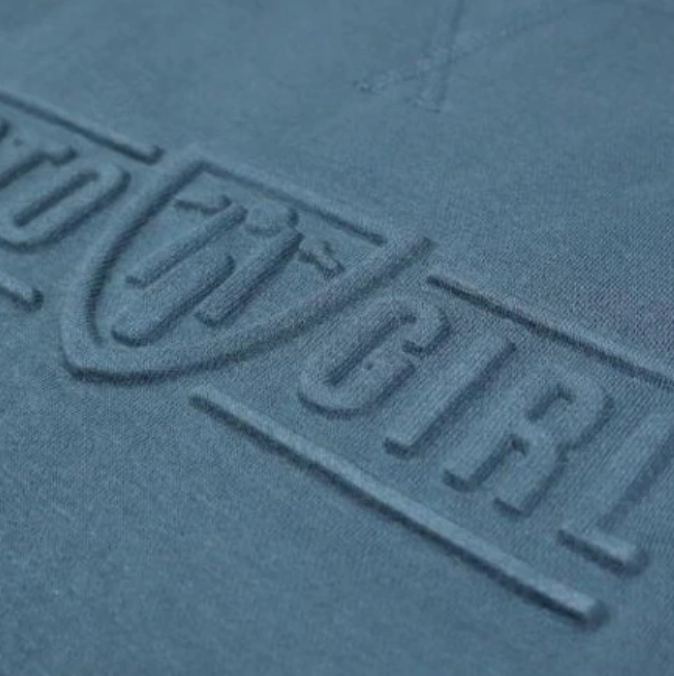 A close up of the 3d logo on a women&#39;s motorcycle sweatshirt from Moto Girl
