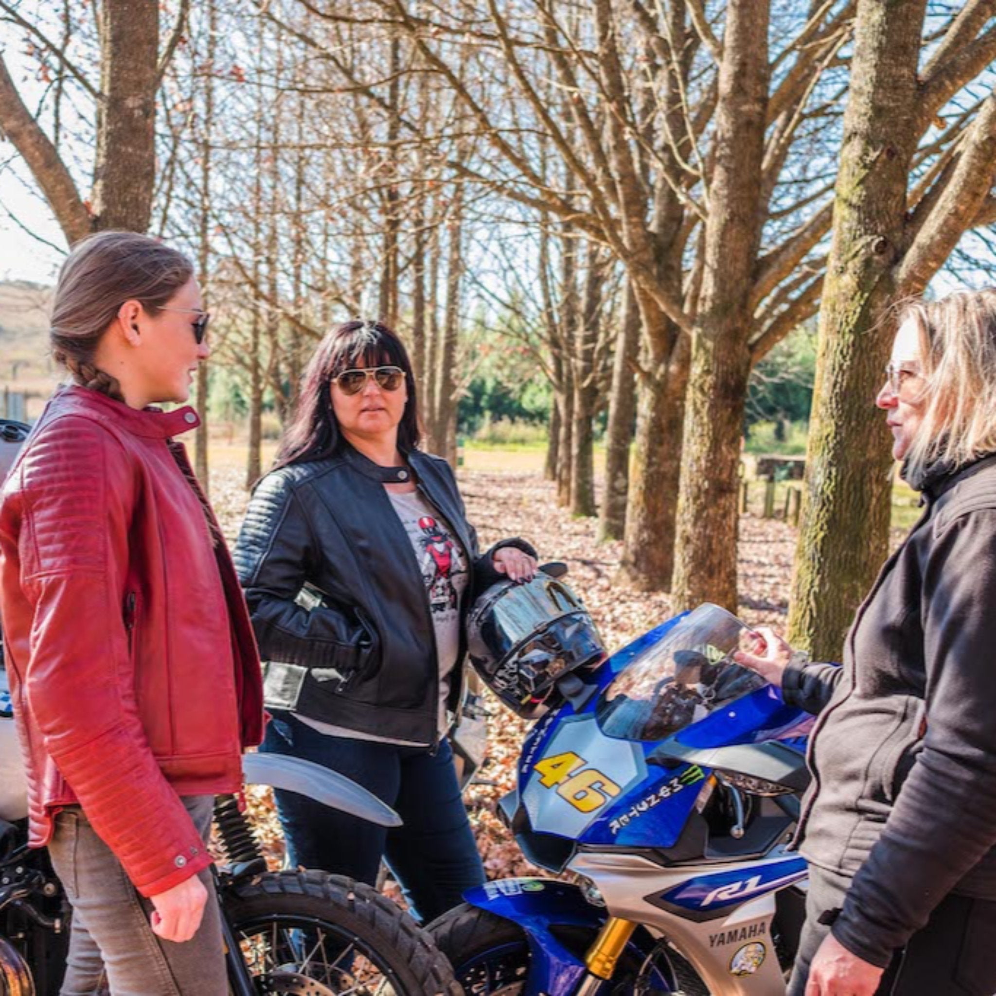 Women enjoying a break during a motorcycle trip wearing motorcycle leather Valerie  jacket from Moto Girl