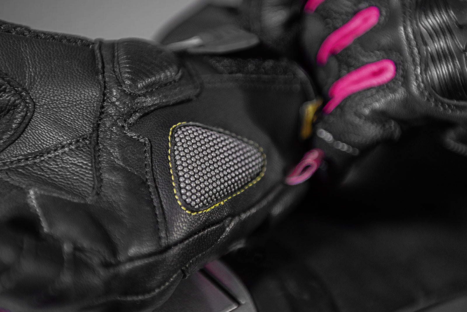 A close up of a palm of Black and pink women&#39;s motorcycle gloves Rush lady  from Shima
