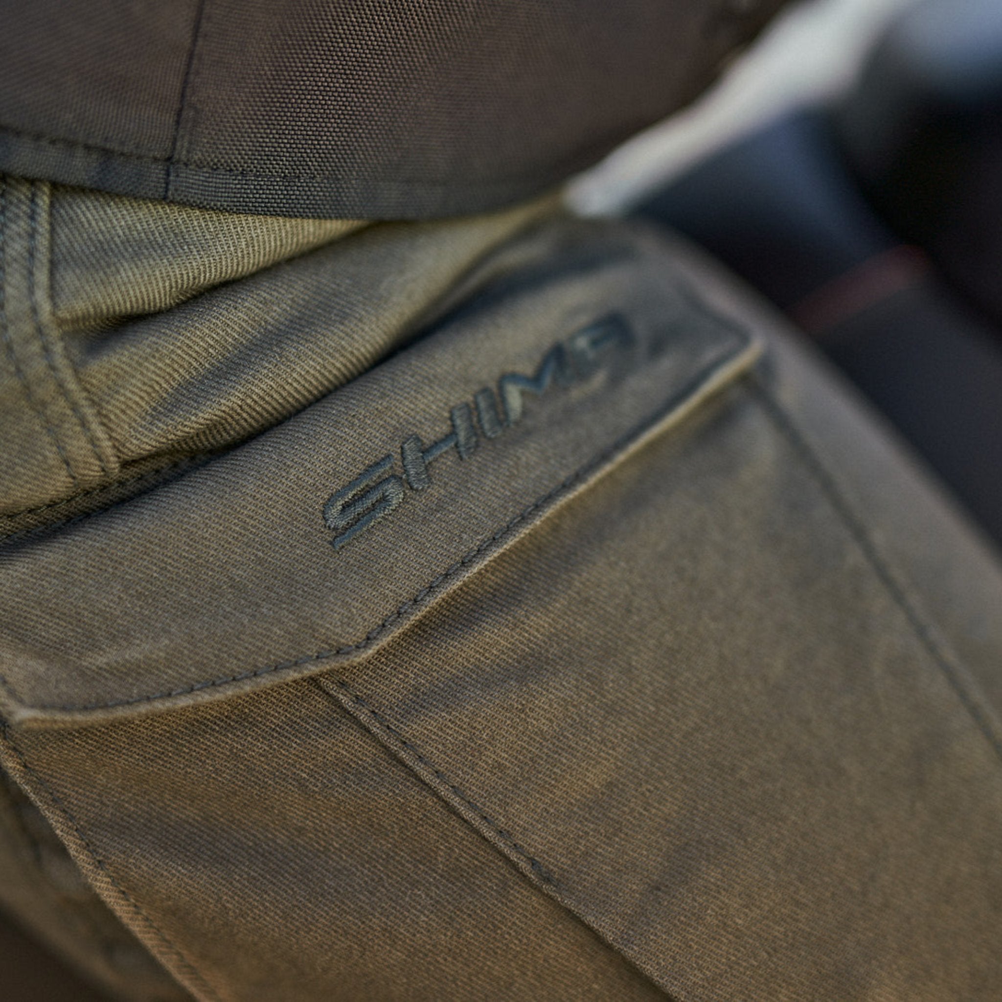 A close up of the pocket of Khaki green women&#39;s motorcycle cargo pants GIRO from shima