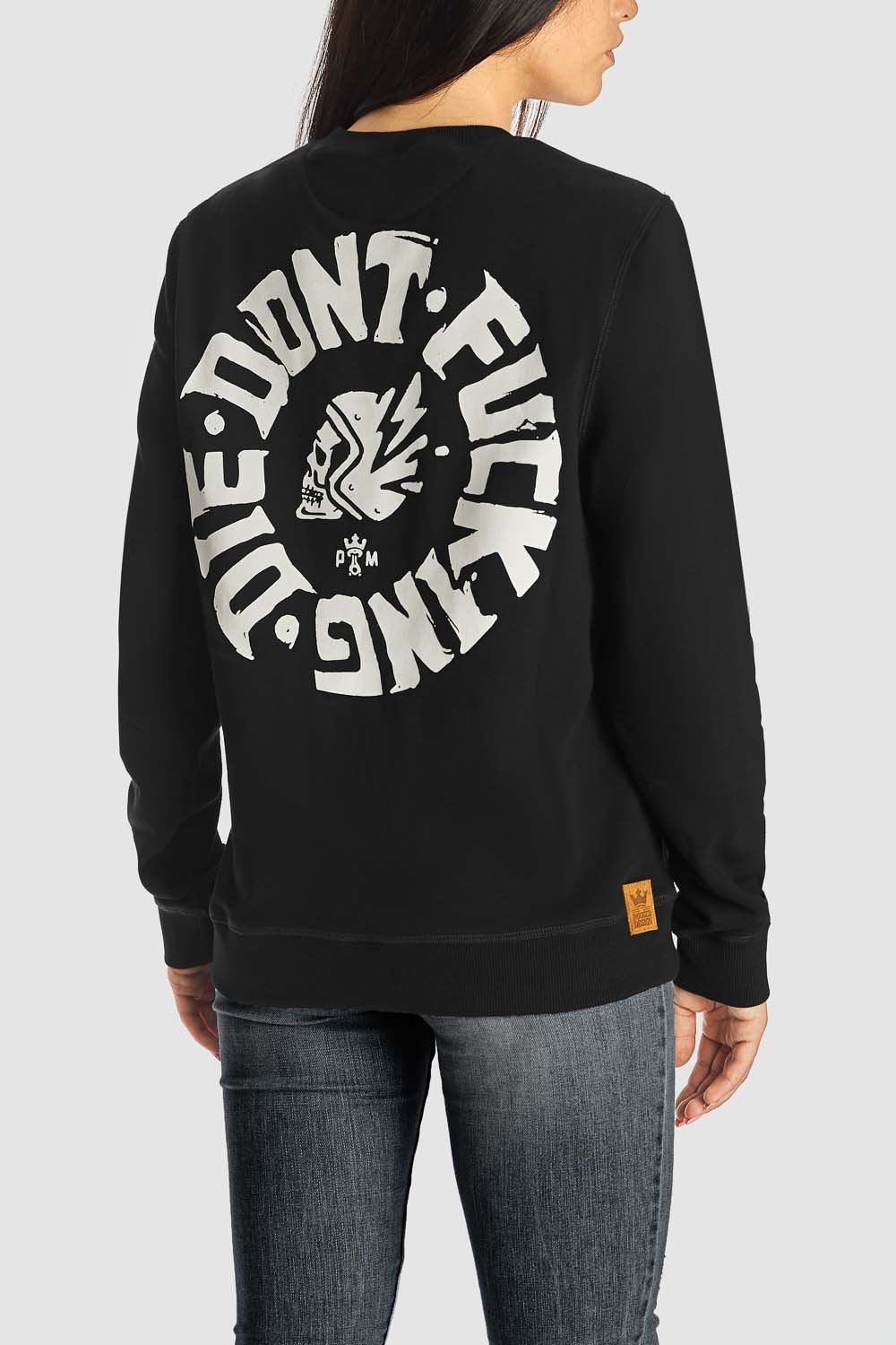 A women wearing black Pando Moto motorcycle sweatshirt with white &quot;don&#39;t fucking die&quot;motive on the back