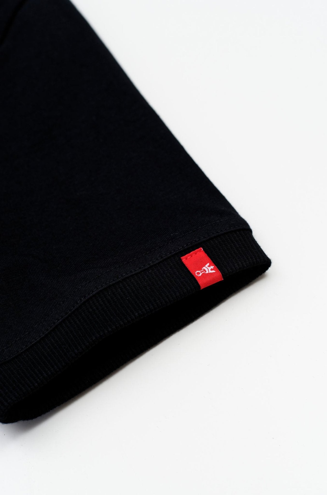 The close up of the sleeve of a black motorcycle t-shirt