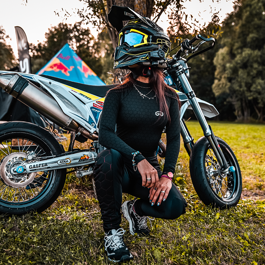 A woman wearing black and red sewings women's motorcycle leggings from exagon66