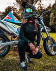 A woman wearing black and red sewings women's motorcycle leggings from exagon66