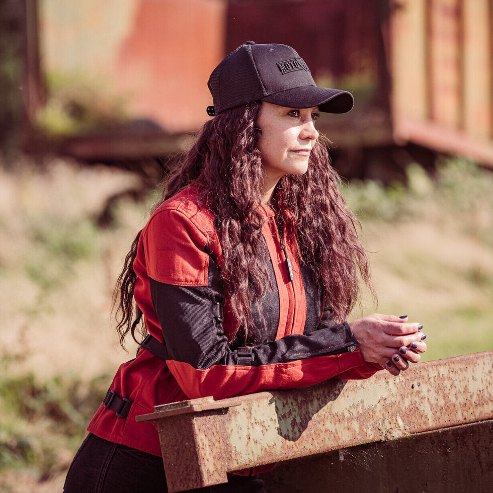 a  woman with the cap wearing red and black women&#39;s motorcycle summer jacket from Moto Girl 